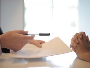 a personal loan borrower sitting with a moneylender in singapore