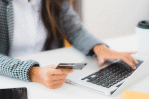 A young woman considers taking a debt consolidation loan while thinking of her growing credit card debts