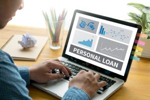 A consumer searching on laptop for the best cash loan or personal loan in Singapore